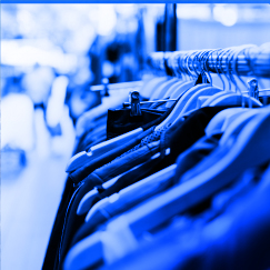 Clothes haning on rack in retail store